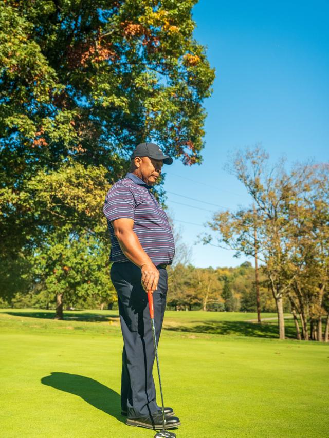 Chad Lumpkin lining up a putt