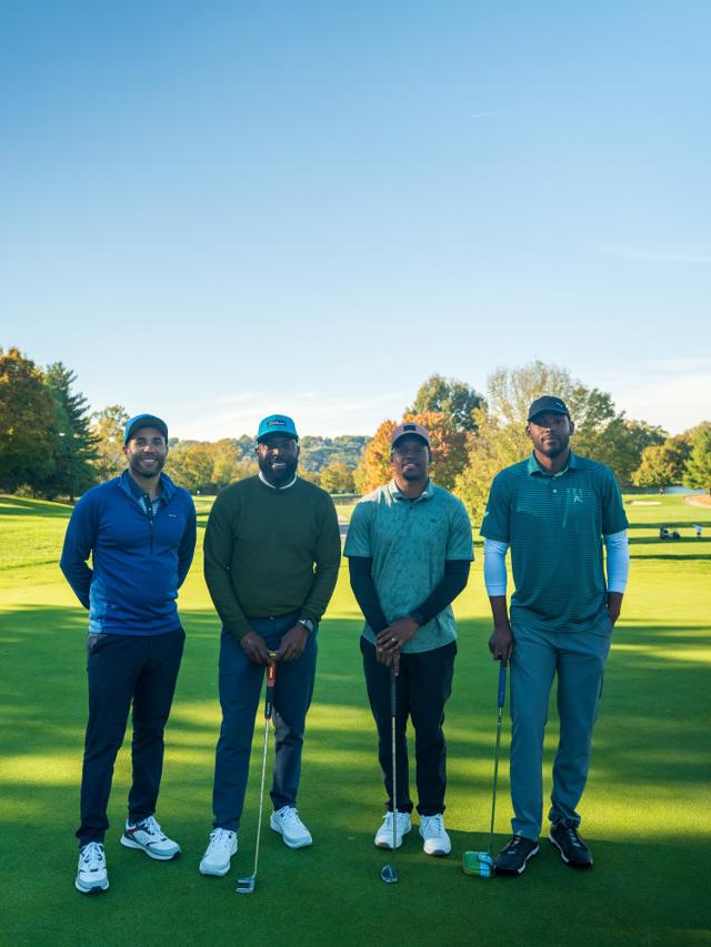 The Pin Seekers reading a putt together on the green