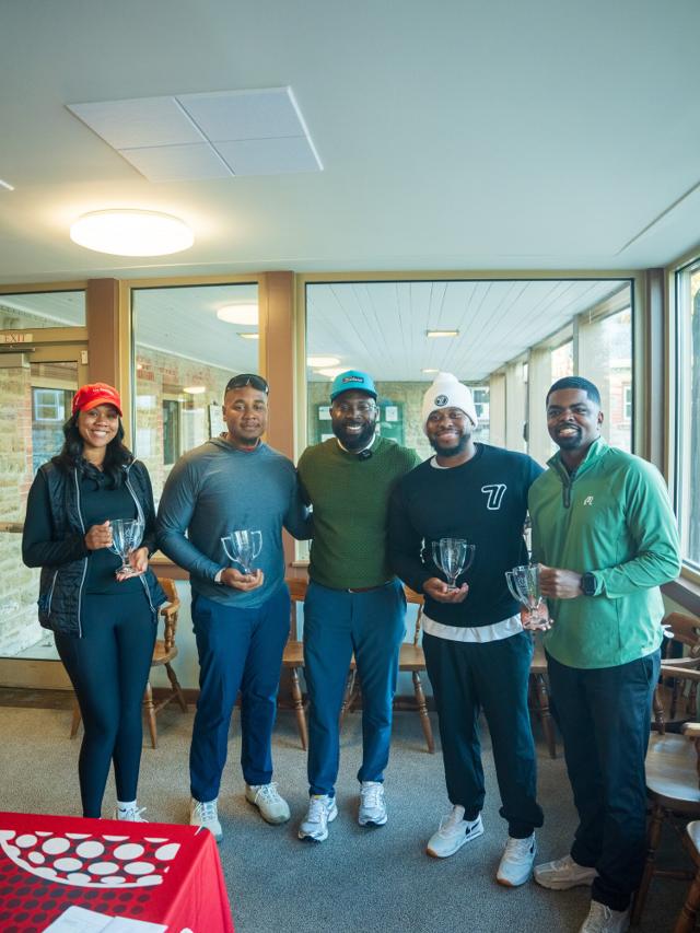 Cincy Black Golfers holding up their tournament trophies